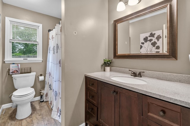491 Toleman Rd, Rock Tavern, NY 12575 - full bathroom featuring toilet, vanity, wood finished floors, and baseboards