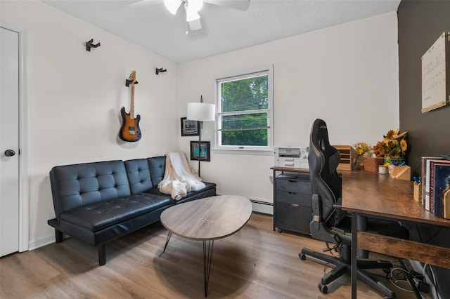 491 Toleman Rd, Rock Tavern, NY 12575 - office space featuring wood finished floors, ceiling fan, and a baseboard heating unit