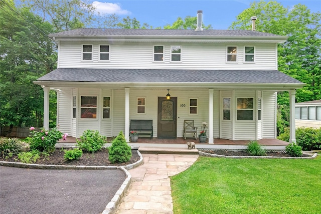 100 Castle Rd, Chappaqua, NY 10514 - view of front of property with a porch, a front yard, and roof with shingles