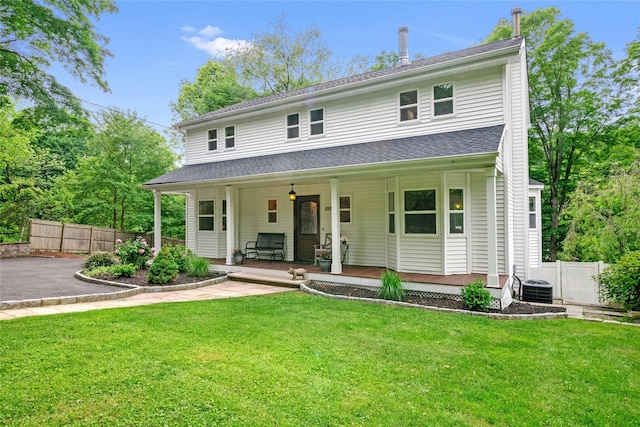 100 Castle Rd, Chappaqua, NY 10514 - view of front facade featuring central air condition unit and a porch