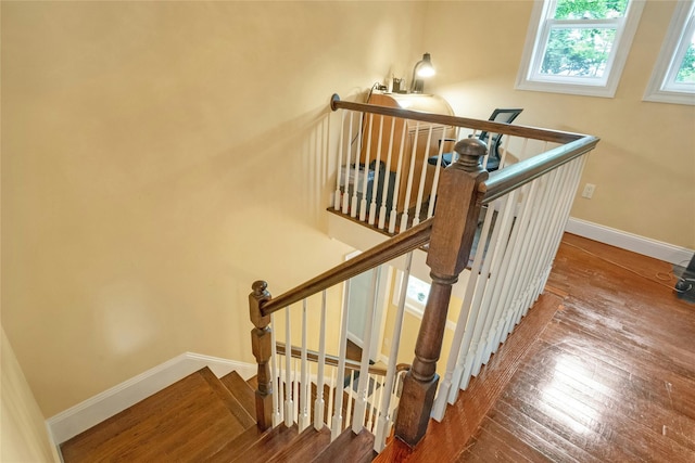 100 Castle Rd, Chappaqua, NY 10514 - stairway with hardwood / wood-style flooring and baseboards