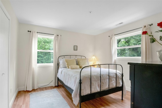 100 Castle Rd, Chappaqua, NY 10514 - bedroom featuring multiple windows, wood finished floors, and baseboards