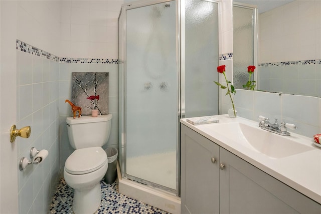 100 Castle Rd, Chappaqua, NY 10514 - bathroom with tile walls, vanity, a shower stall, and toilet
