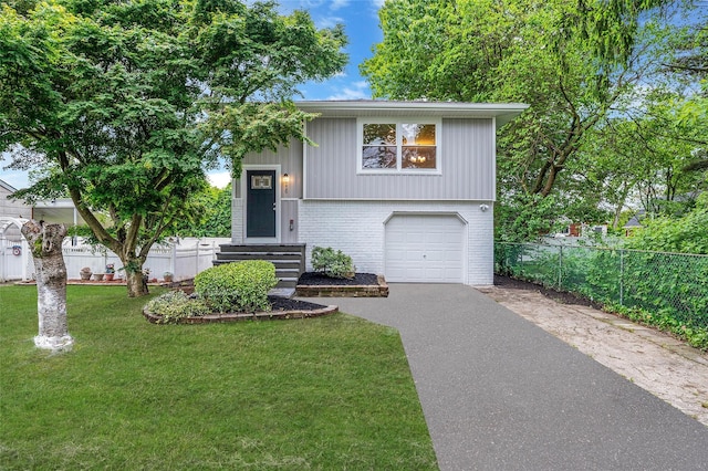 116 Amsterdam Ave, West Babylon, NY 11704 - bi-level home with brick siding, asphalt driveway, and an attached garage