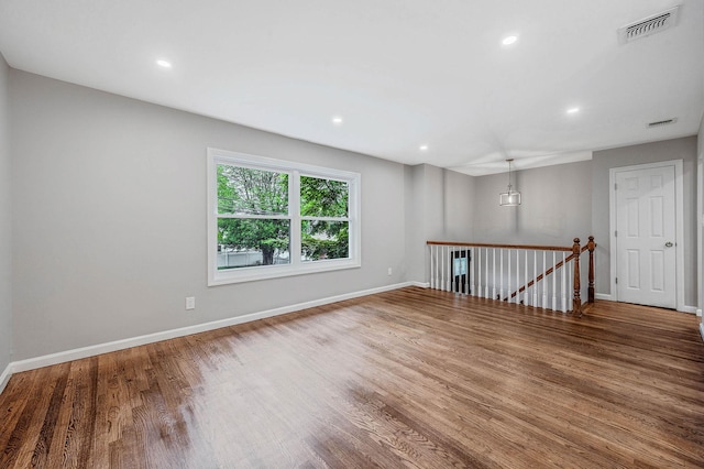 116 Amsterdam Ave, West Babylon, NY 11704 - empty room featuring wood finished floors, baseboards, and recessed lighting