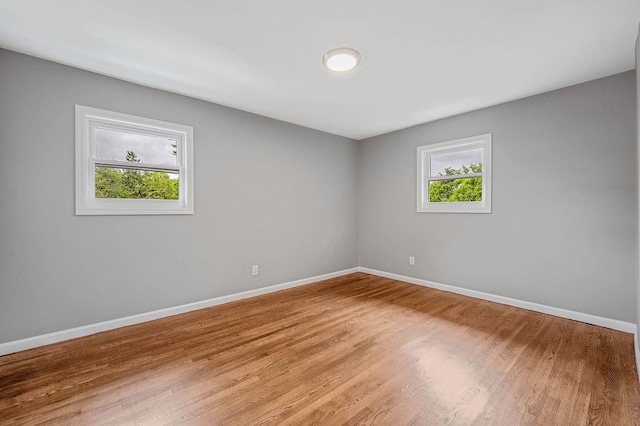 116 Amsterdam Ave, West Babylon, NY 11704 - empty room featuring baseboards and light wood-type flooring