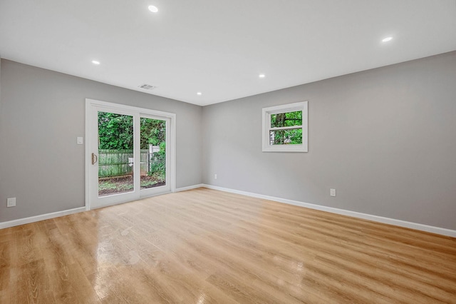116 Amsterdam Ave, West Babylon, NY 11704 - unfurnished room featuring baseboards, light wood finished floors, and recessed lighting