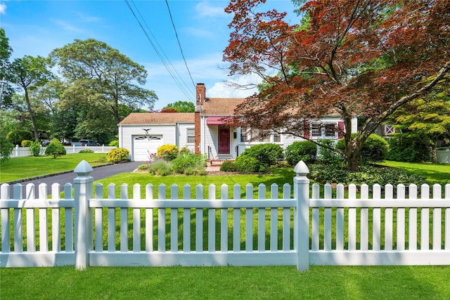 224 Washington Ave, Saint James, NY 11780 - view of front of property with a garage, driveway, and a chimney