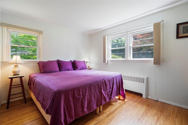 224 Washington Ave, Saint James, NY 11780 - bedroom featuring radiator and light wood-style flooring