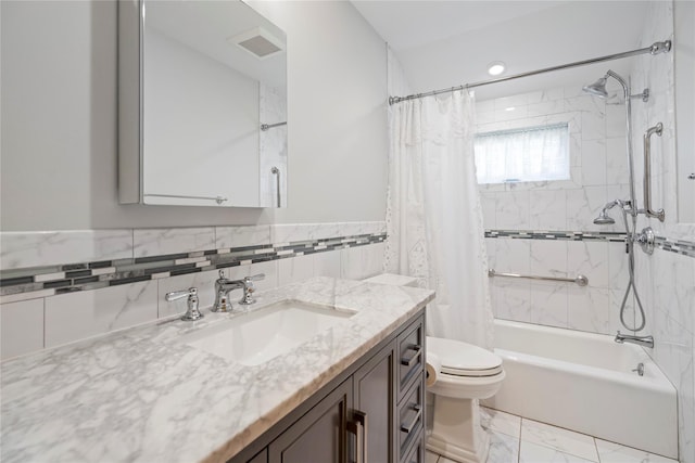224 Washington Ave, Saint James, NY 11780 - full bathroom featuring vanity, shower / bath combo, toilet, tile walls, and wainscoting