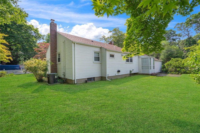 224 Washington Ave, Saint James, NY 11780 - rear view of house with a chimney and central AC