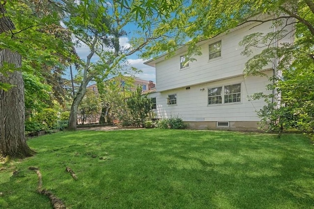 764 Sherwood Ct, North Woodmere, NY 11581 - rear view of house featuring a lawn
