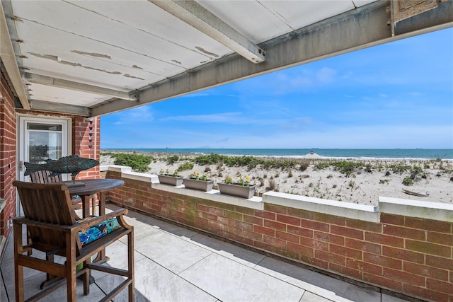 750 Shore Rd Unit 1M, Long Beach, NY 11561 - view of patio / terrace with view of water and beach