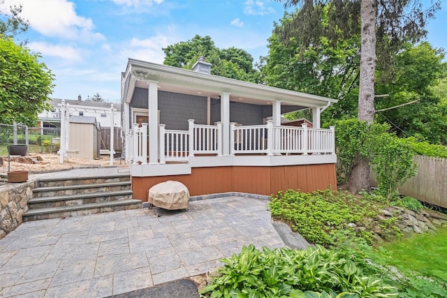 12 Hillside Ter, Amawalk, NY 10501 - view of front facade featuring a chimney and a patio area
