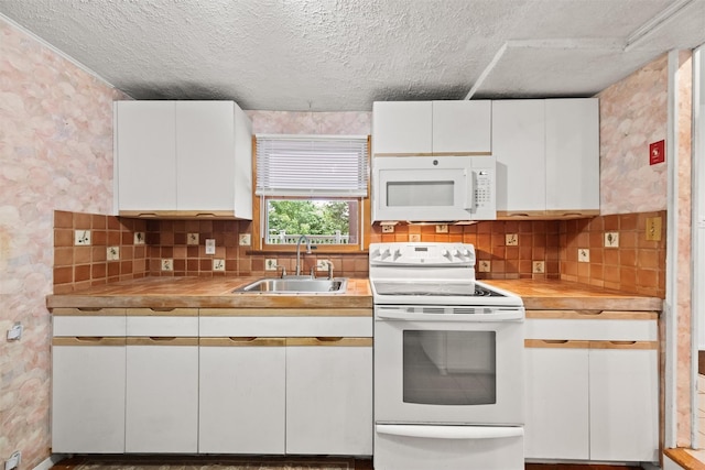 12 Hillside Ter, Amawalk, NY 10501 - kitchen with white appliances, a sink, a textured ceiling, white cabinetry, and light countertops
