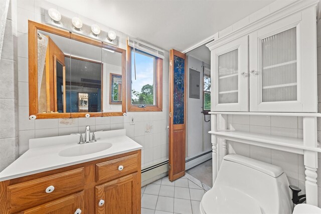 12 Hillside Ter, Amawalk, NY 10501 - bathroom with tile walls, baseboard heating, toilet, tile patterned floors, and vanity