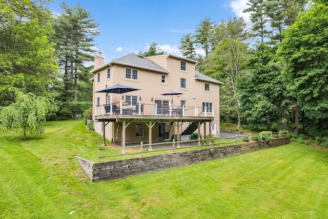 8 Upland Ct, South Salem, NY 10590 - rear view of house with stucco siding, a deck, a chimney, a lawn, and stairway