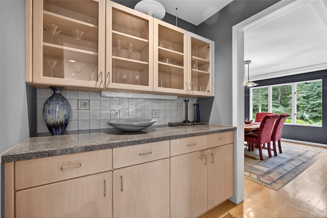 109 Sleight Plass Rd, Poughkeepsie, NY 12603 - kitchen featuring light wood-type flooring, backsplash, light brown cabinets, and glass insert cabinets