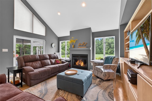 109 Sleight Plass Rd, Poughkeepsie, NY 12603 - living room featuring wood finished floors, healthy amount of natural light, high vaulted ceiling, a glass covered fireplace, and recessed lighting