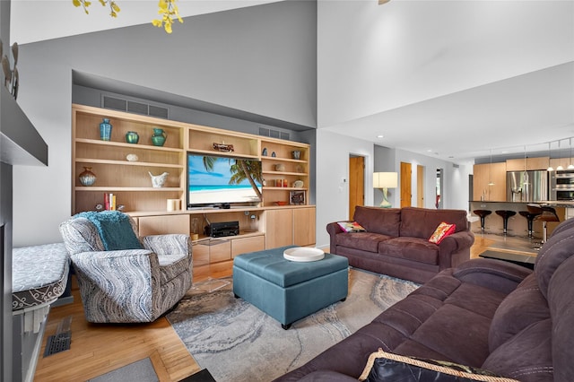 109 Sleight Plass Rd, Poughkeepsie, NY 12603 - living room featuring wood finished floors and a high ceiling