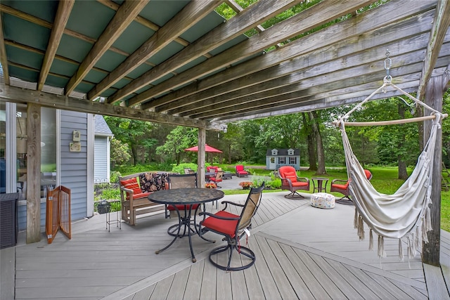 109 Sleight Plass Rd, Poughkeepsie, NY 12603 - wooden deck with outdoor dining area and an outbuilding