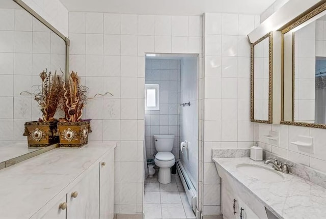 3226 165th St, Flushing, NY 11358 - full bath featuring tile walls, a baseboard radiator, vanity, toilet, and tile patterned floors