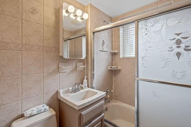 3226 165th St, Flushing, NY 11358 - full bathroom featuring combined bath / shower with glass door, toilet, vanity, and tile walls