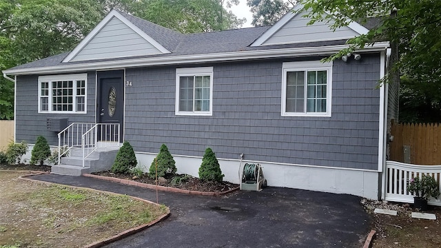 34 Park Ln, Medford, NY 11763 - view of front of house featuring a patio area and a shingled roof