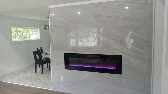 34 Park Ln, Medford, NY 11763 - detailed view of a glass covered fireplace and baseboards