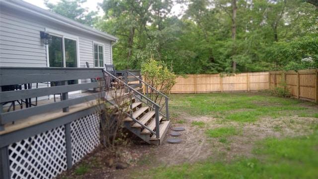 34 Park Ln, Medford, NY 11763 - fenced backyard with stairs and a wooden deck