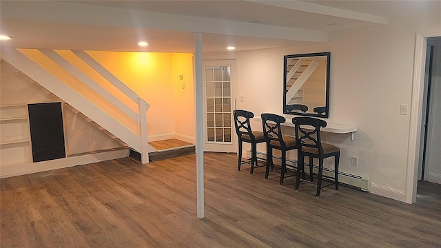 34 Park Ln, Medford, NY 11763 - dining room with wood finished floors, recessed lighting, stairs, baseboards, and a baseboard radiator