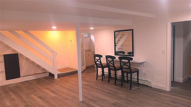 34 Park Ln, Medford, NY 11763 - dining area with wood finished floors, baseboards, recessed lighting, stairs, and a baseboard heating unit
