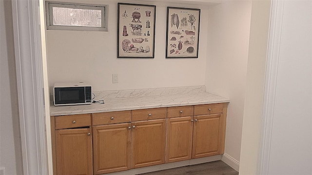 34 Park Ln, Medford, NY 11763 - detailed view of black microwave and wood finished floors