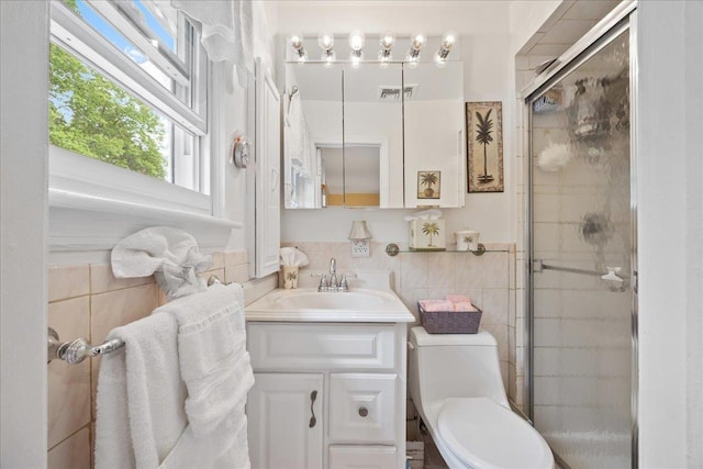 550 Saw Mill River Rd, Millwood, NY 10546 - bathroom featuring tile walls, a shower stall, vanity, and toilet