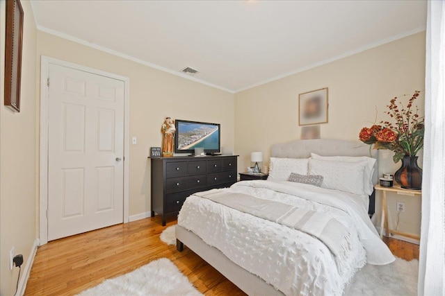 550 Saw Mill River Rd, Millwood, NY 10546 - bedroom featuring wood finished floors, ornamental molding, and baseboards