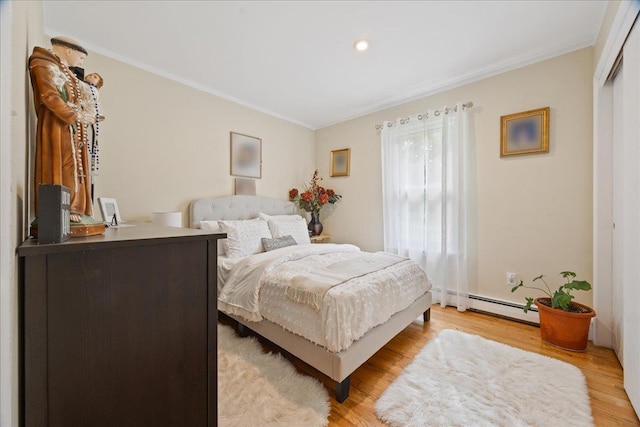 550 Saw Mill River Rd, Millwood, NY 10546 - bedroom featuring a baseboard heating unit, crown molding, light wood-style flooring, and recessed lighting
