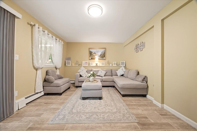 550 Saw Mill River Rd, Millwood, NY 10546 - living area with a baseboard radiator, wood finished floors, and baseboards