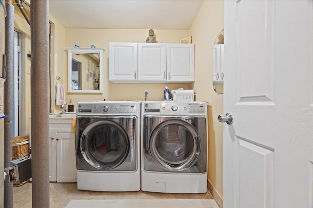 550 Saw Mill River Rd, Millwood, NY 10546 - washroom featuring cabinet space, washing machine and dryer, and light tile patterned flooring