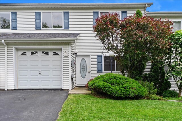 221 Tamerisk Ln, New Windsor, NY 12553 - view of front facade featuring a garage and a front yard