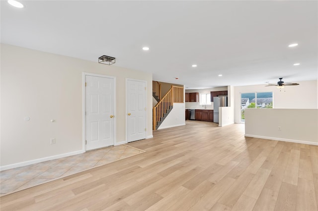 221 Tamerisk Ln, New Windsor, NY 12553 - unfurnished living room with recessed lighting, light wood-style floors, stairs, a ceiling fan, and baseboards