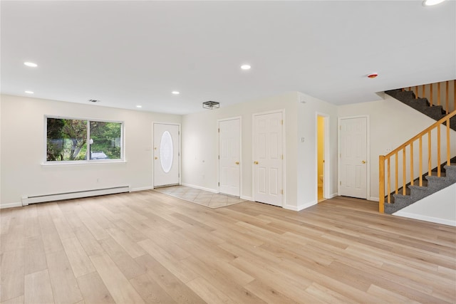 221 Tamerisk Ln, New Windsor, NY 12553 - foyer entrance featuring baseboard heating, light wood-style floors, stairs, recessed lighting, and baseboards