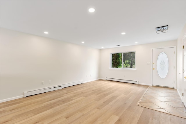 221 Tamerisk Ln, New Windsor, NY 12553 - foyer entrance featuring a baseboard heating unit, light wood-type flooring, recessed lighting, and baseboards