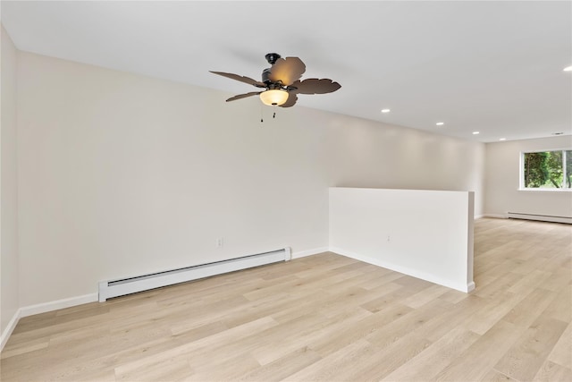 221 Tamerisk Ln, New Windsor, NY 12553 - unfurnished room featuring a baseboard radiator, light wood finished floors, ceiling fan, recessed lighting, and baseboards