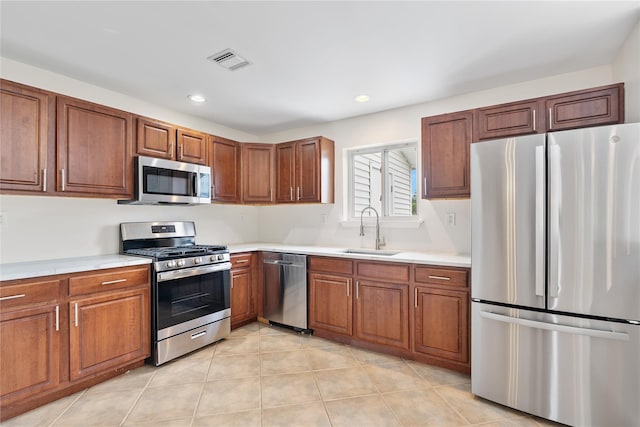 221 Tamerisk Ln, New Windsor, NY 12553 - kitchen featuring stainless steel appliances, a sink, light countertops, and recessed lighting