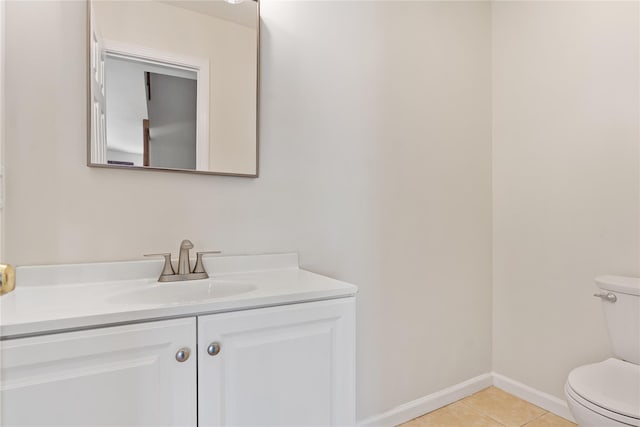 221 Tamerisk Ln, New Windsor, NY 12553 - half bathroom featuring toilet, vanity, tile patterned flooring, and baseboards