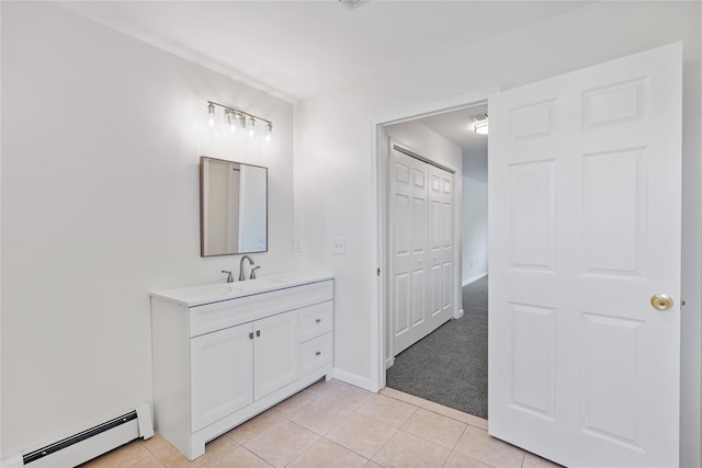 221 Tamerisk Ln, New Windsor, NY 12553 - bathroom featuring baseboard heating, vanity, tile patterned floors, and baseboards