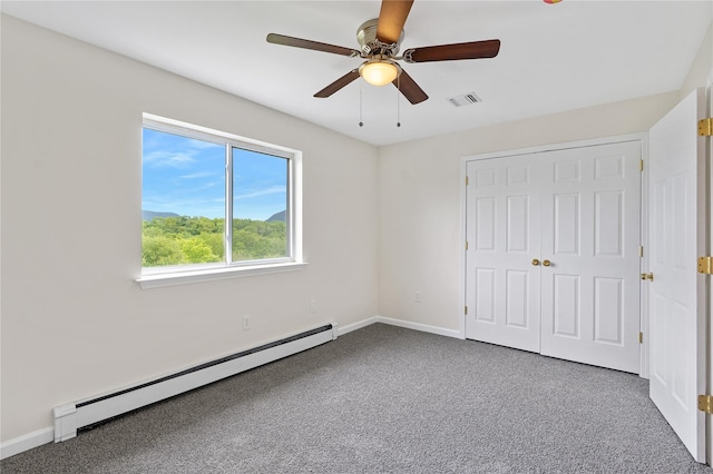 221 Tamerisk Ln, New Windsor, NY 12553 - unfurnished bedroom with a baseboard radiator, carpet, baseboards, and a ceiling fan