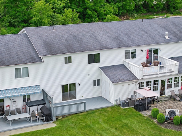 221 Tamerisk Ln, New Windsor, NY 12553 - rear view of property with central AC, a lawn, and a deck