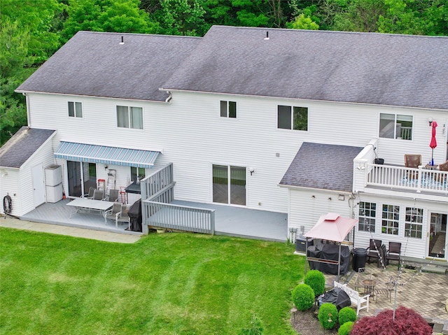 221 Tamerisk Ln, New Windsor, NY 12553 - back of property with a yard, a patio area, roof with shingles, and a wooden deck