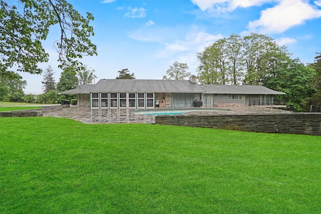 736 State Route 94 N, Warwick, NY 10990 - back of property with a patio area, a lawn, and a chimney